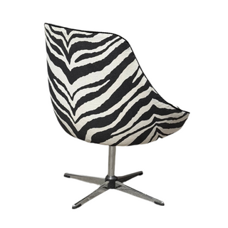 Vintage swivel armchair upholstered in black zebra