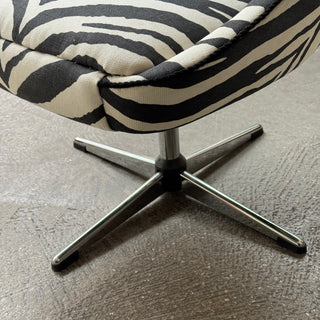 Vintage swivel armchair upholstered in black zebra