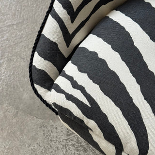 Vintage swivel armchair upholstered in black zebra